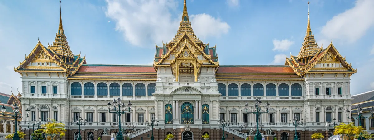 The Grand Palace's golden spires and colorful mosaic-tiled buildings in Bangkok