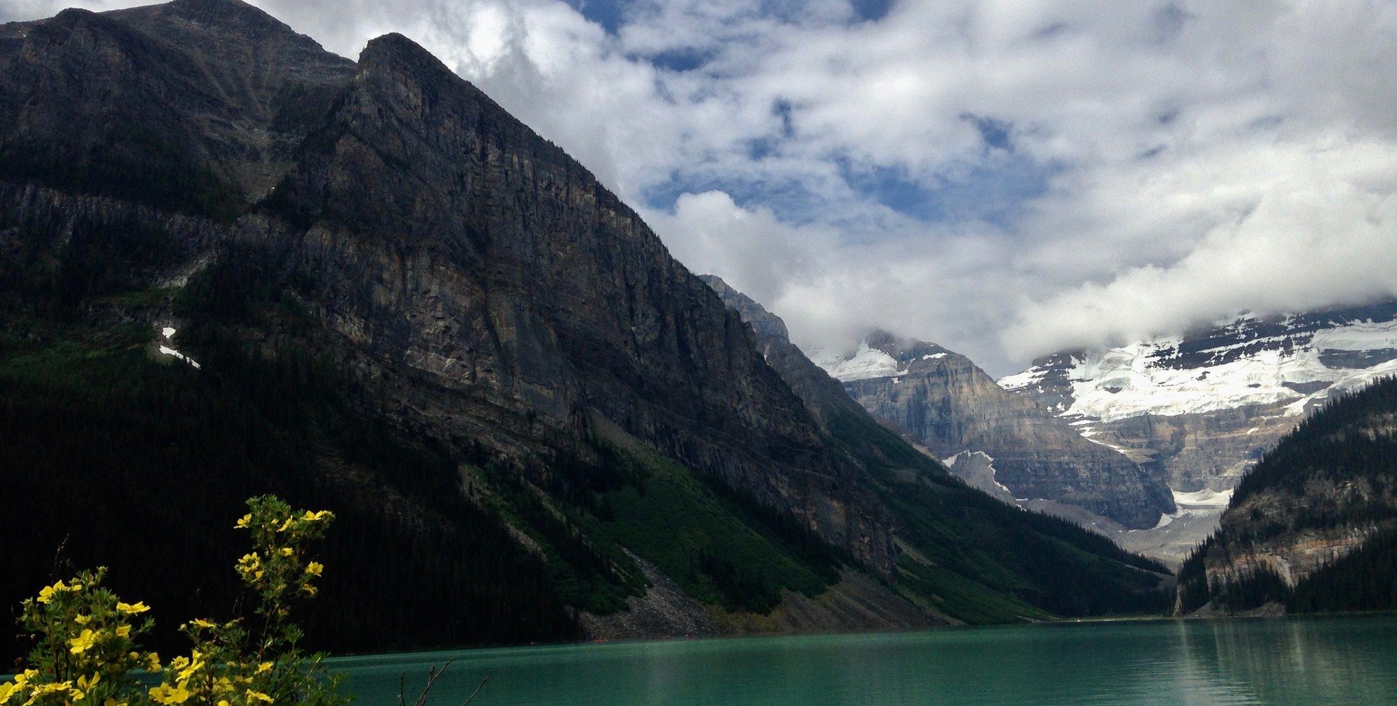 Turquoise waters of Lake Louise below the glacier-capped peaks of Banff National Park