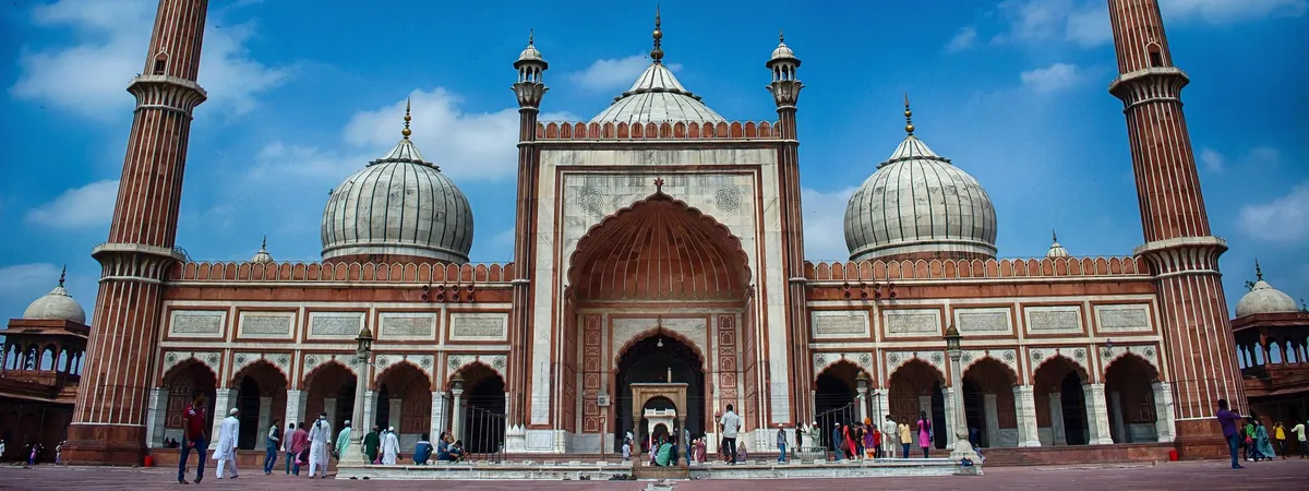 Jama Masjid's marble domes and minarets in Old Delhi, seen head-on from the courtyard