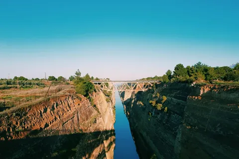 The Corinth Canal's sheer rock walls, cut through to connect the Gulf of Corinth to the Saronic Gulf