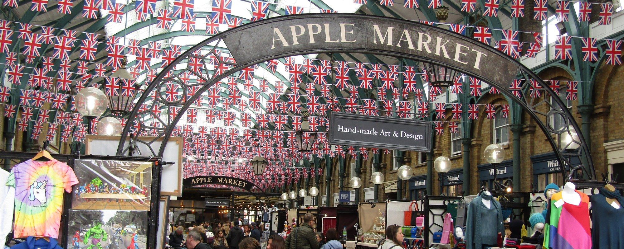 The Apple Market entrance inside Covent Garden's historic market building, hung with bunting