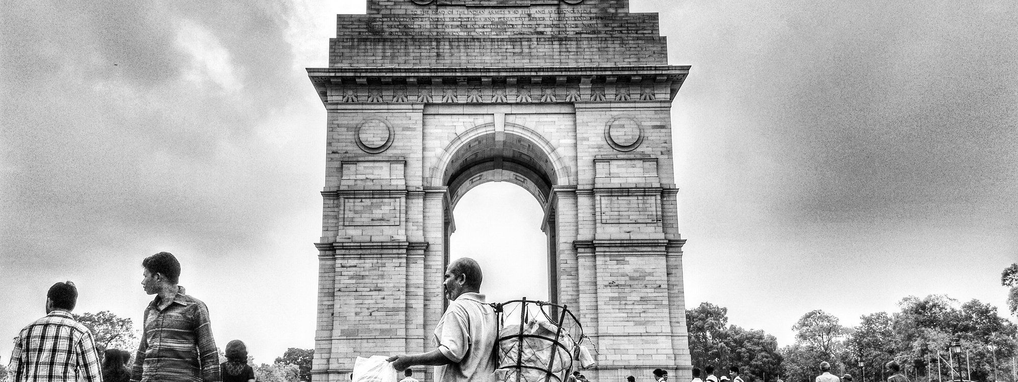India Gate war memorial in New Delhi, seen head-on against a clear sky
