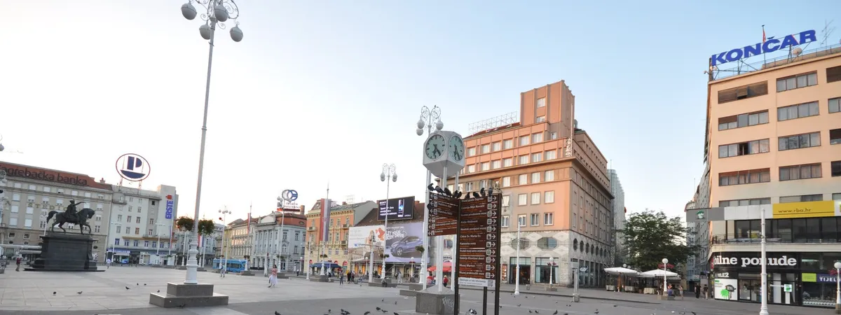 Ban Jelačić Square at dawn with the equestrian statue and surrounding 19th-century facades
