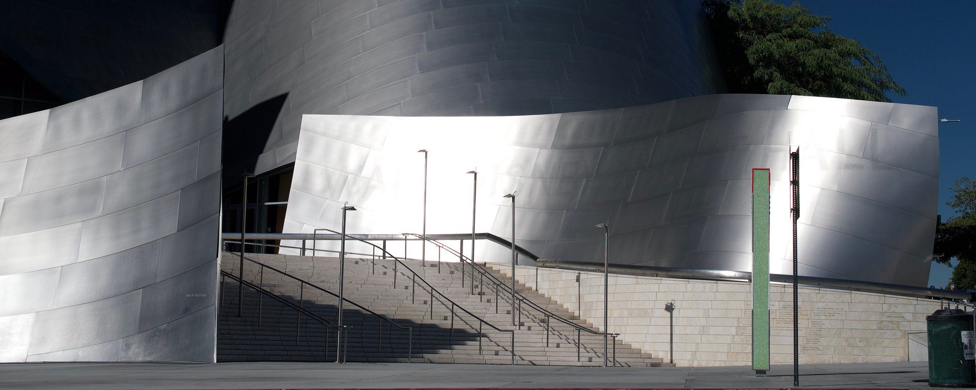 The curved, stainless-steel exterior and entrance staircase of Frank Gehry's Walt Disney Concert Hall in Downtown Los Angeles