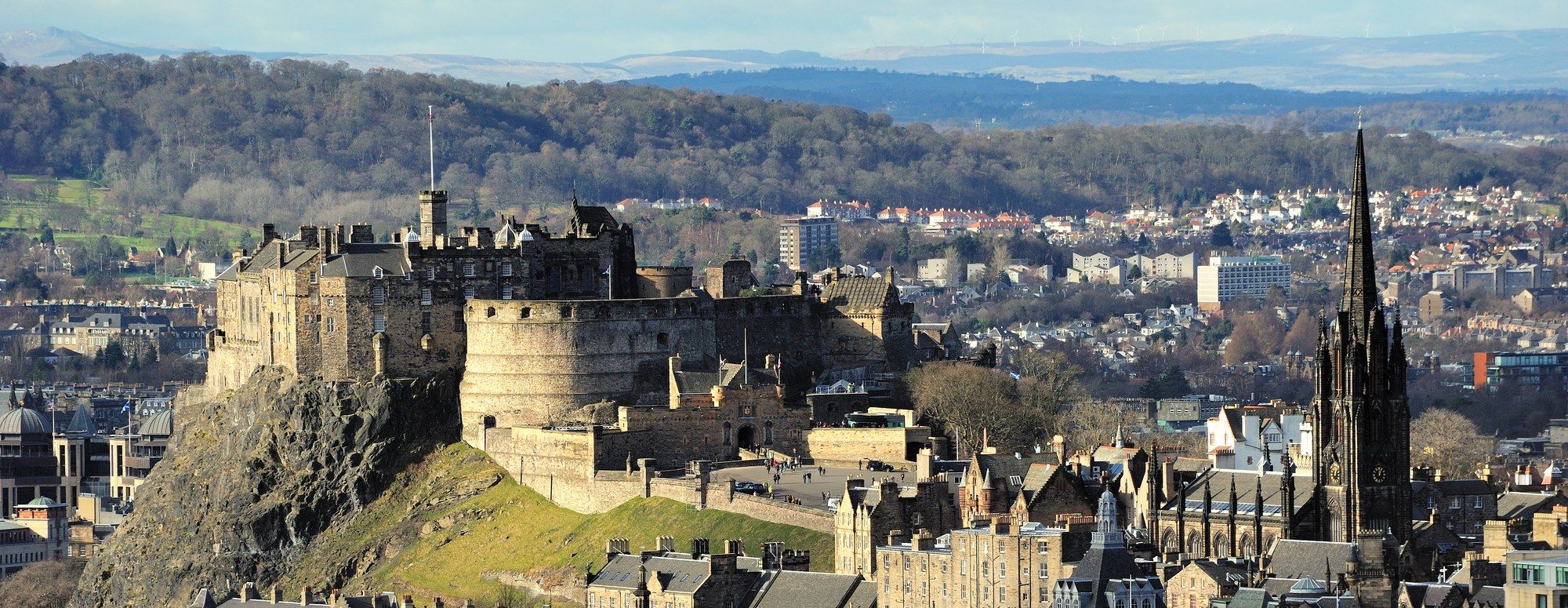 Edinburgh Castle on its volcanic rock, seen above the rooftops of the Old Town