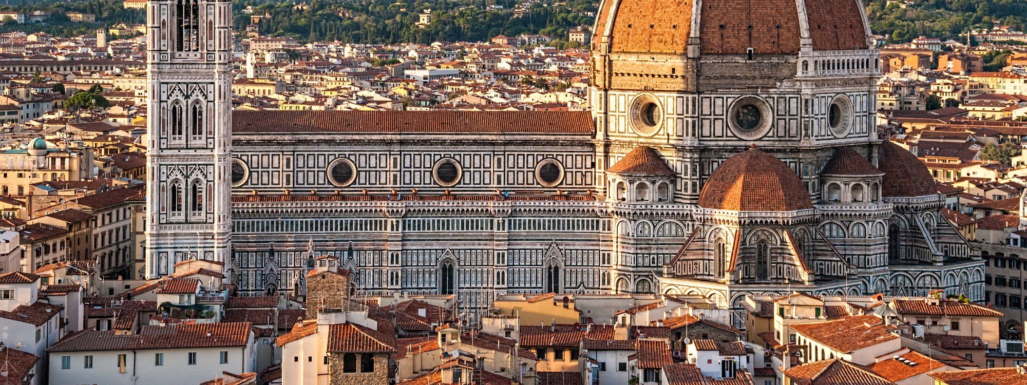 Florence Cathedral (the Duomo) with Brunelleschi's dome and Giotto's bell tower, seen above the terracotta rooftops of the historic center