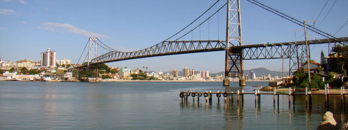 The Hercílio Luz suspension bridge spanning the bay between mainland Florianópolis and Santa Catarina Island at sunrise