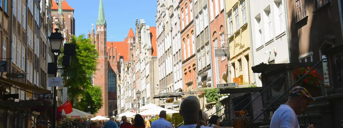 Mariacka Street's ornate stone porches and amber shops leading toward St. Mary's Basilica in Gdańsk's Main Town