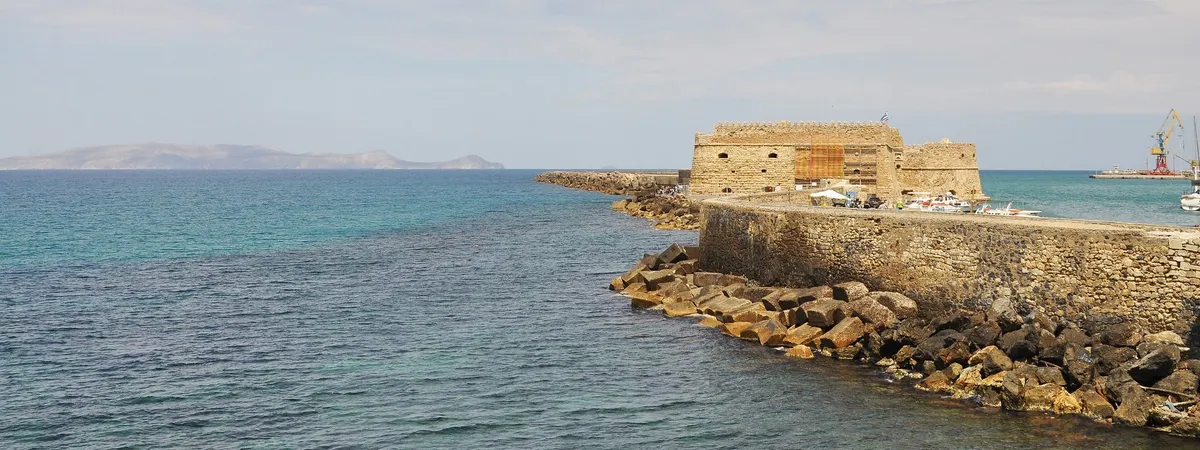 The Venetian Koules Fortress at the entrance to Heraklion's old harbour, with the harbour wall and the Aegean Sea in front of it