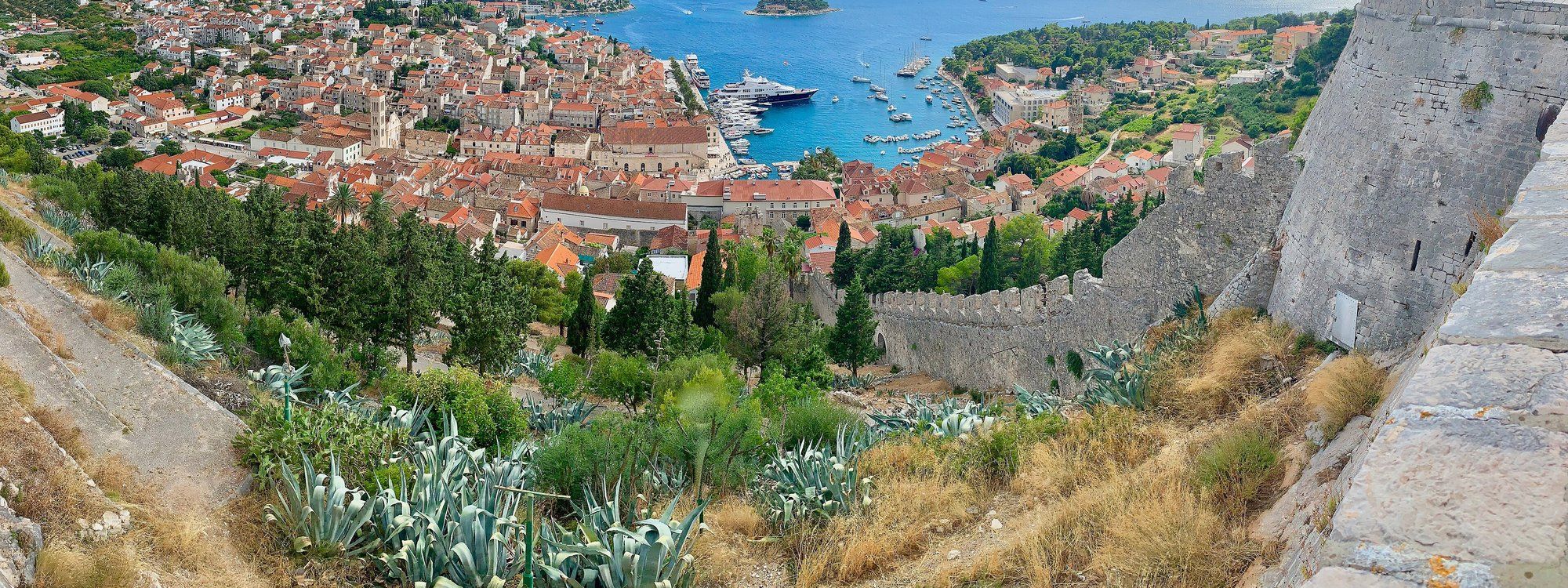 View from the Spanish Fortress over Hvar Town's red-roofed old town and the yacht-filled harbor