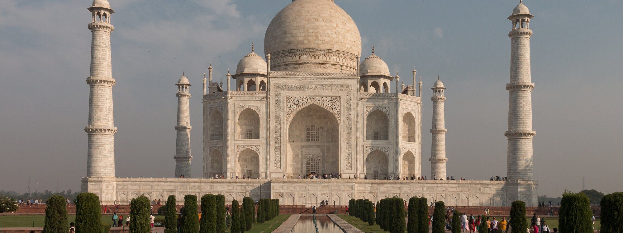 The Taj Mahal in Agra, seen head-on across its reflecting pool