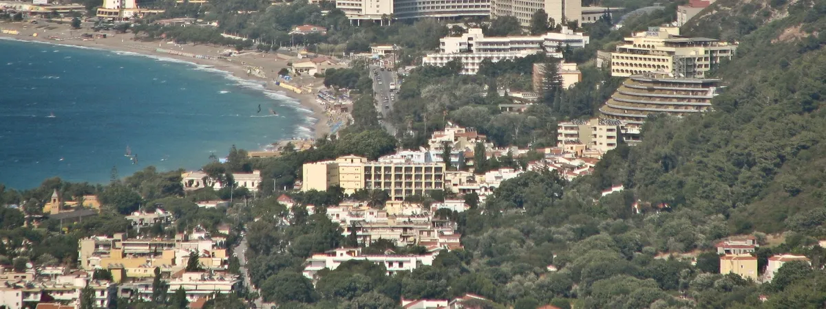 Ixia's beachfront resort strip and windsurfing bay on Rhodes' northwest coast, seen from the hillside above