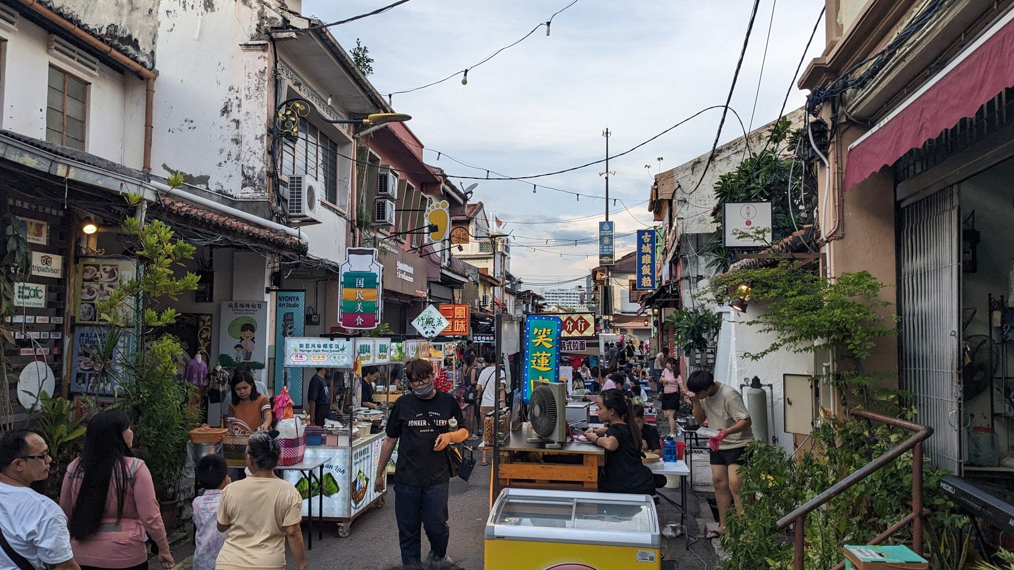Food stalls and shophouses along Jonker Street during its Friday-to-Sunday night market in Malacca