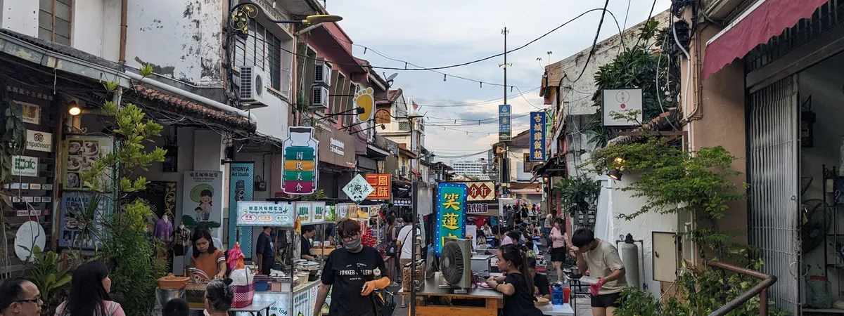 Food stalls and shophouses along Jonker Street during its Friday-to-Sunday night market in Malacca
