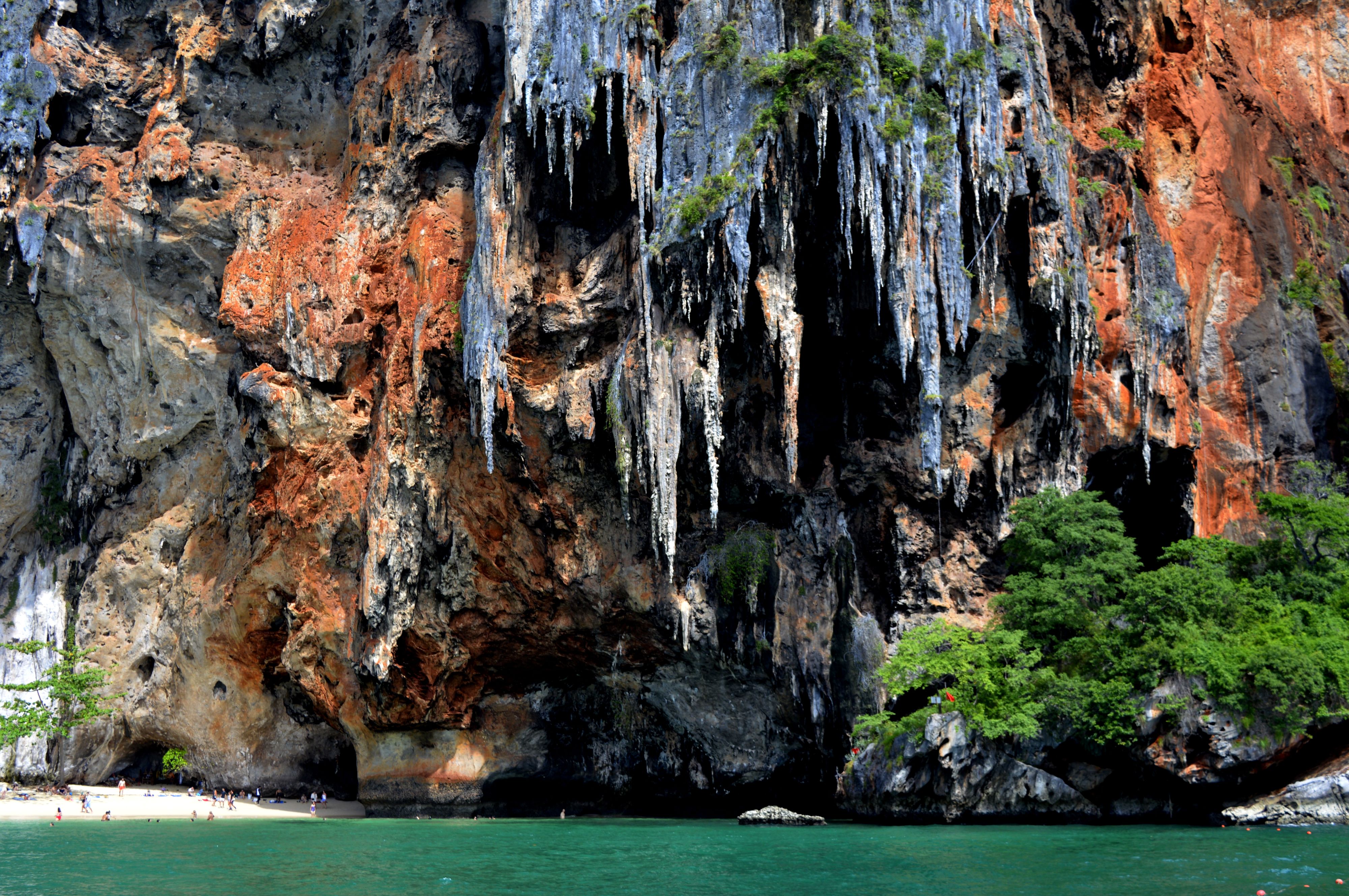 Sheer limestone karst cliffs rising over the water near Railay Beach, Krabi