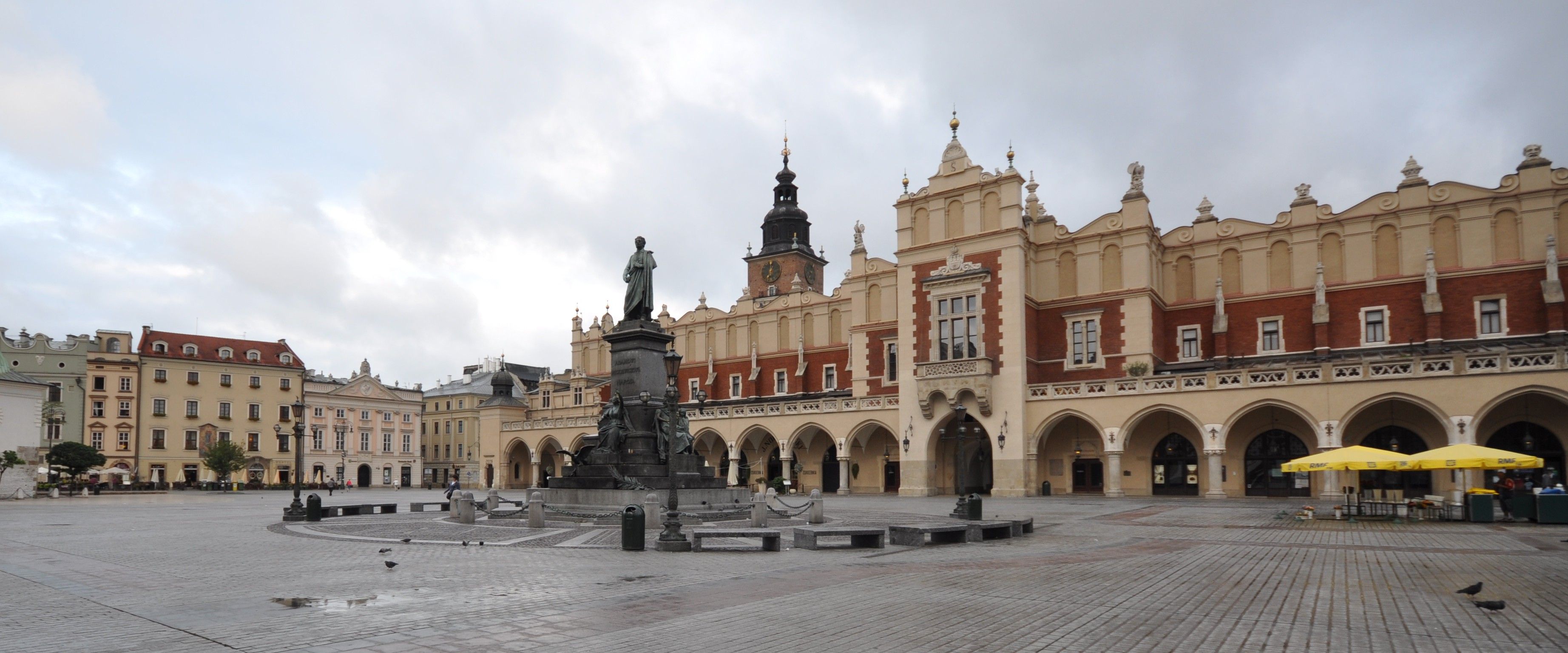 The Cloth Hall and Town Hall Tower on Kraków's Main Market Square, with the Adam Mickiewicz Monument in front