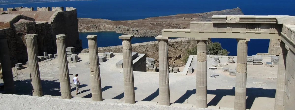 The Doric columns of the Temple of Athena Lindia on the Acropolis of Lindos, overlooking Lindos Bay