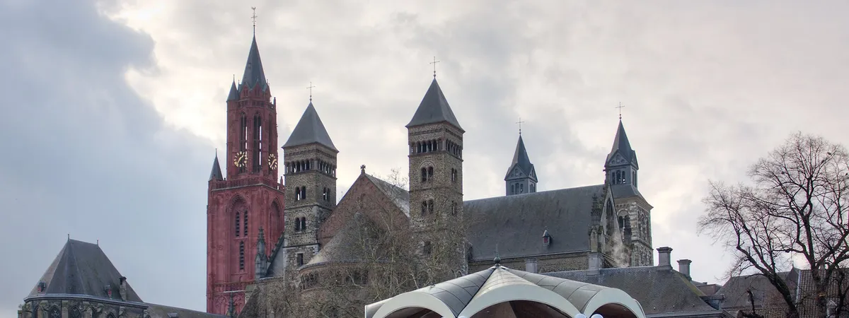 The towers of St. John's Church and the Basilica of Saint Servatius rising above the Vrijthof square in Maastricht