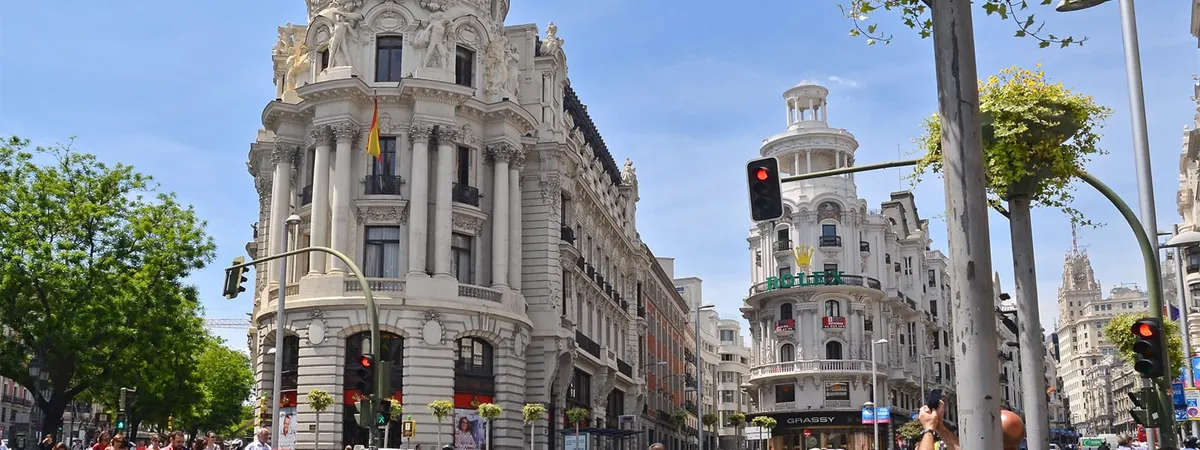 The Metropolis Building on Gran Vía in Madrid, seen from the street on a clear day