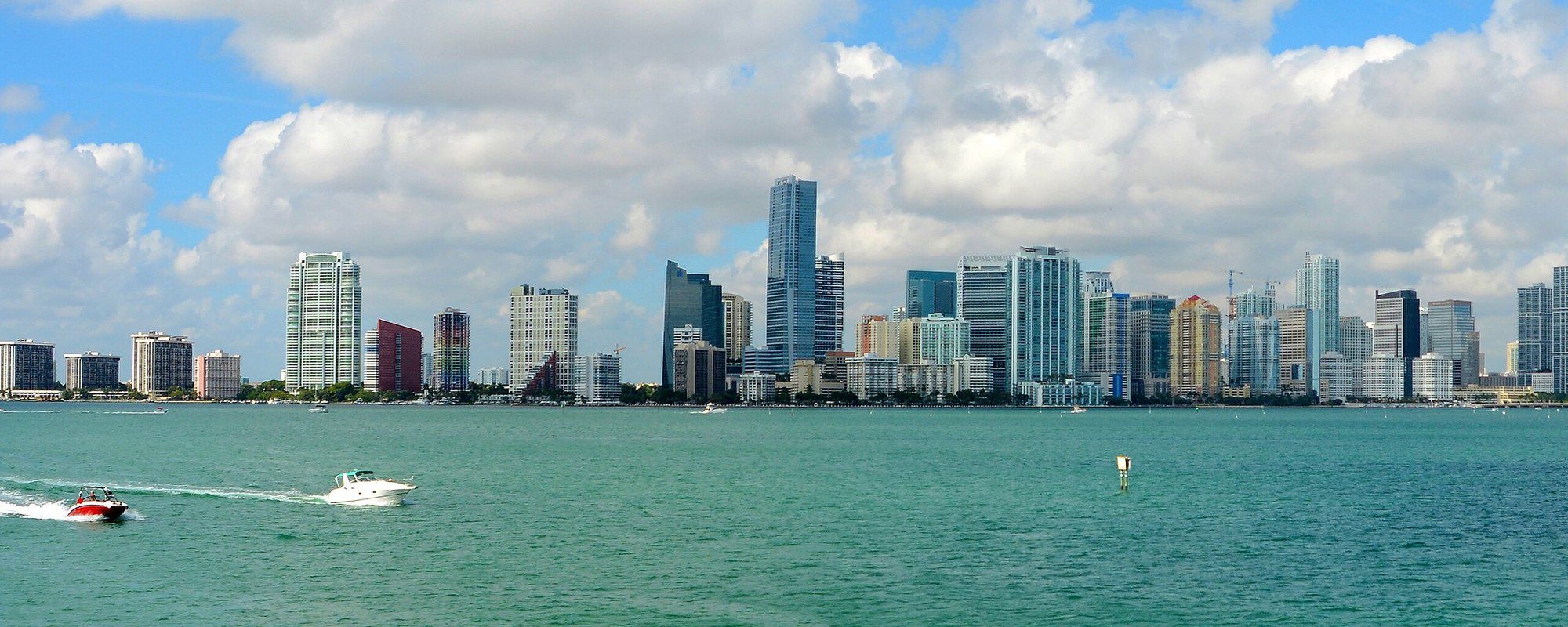 Downtown Miami's skyline of glass towers seen across Biscayne Bay from the Rusty Pelican on Rickenbacker Causeway