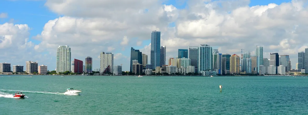 Downtown Miami's skyline of glass towers seen across Biscayne Bay from the Rusty Pelican on Rickenbacker Causeway