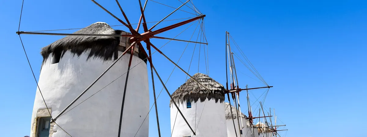 The whitewashed windmills of Kato Mili overlooking the sea in Mykonos Town