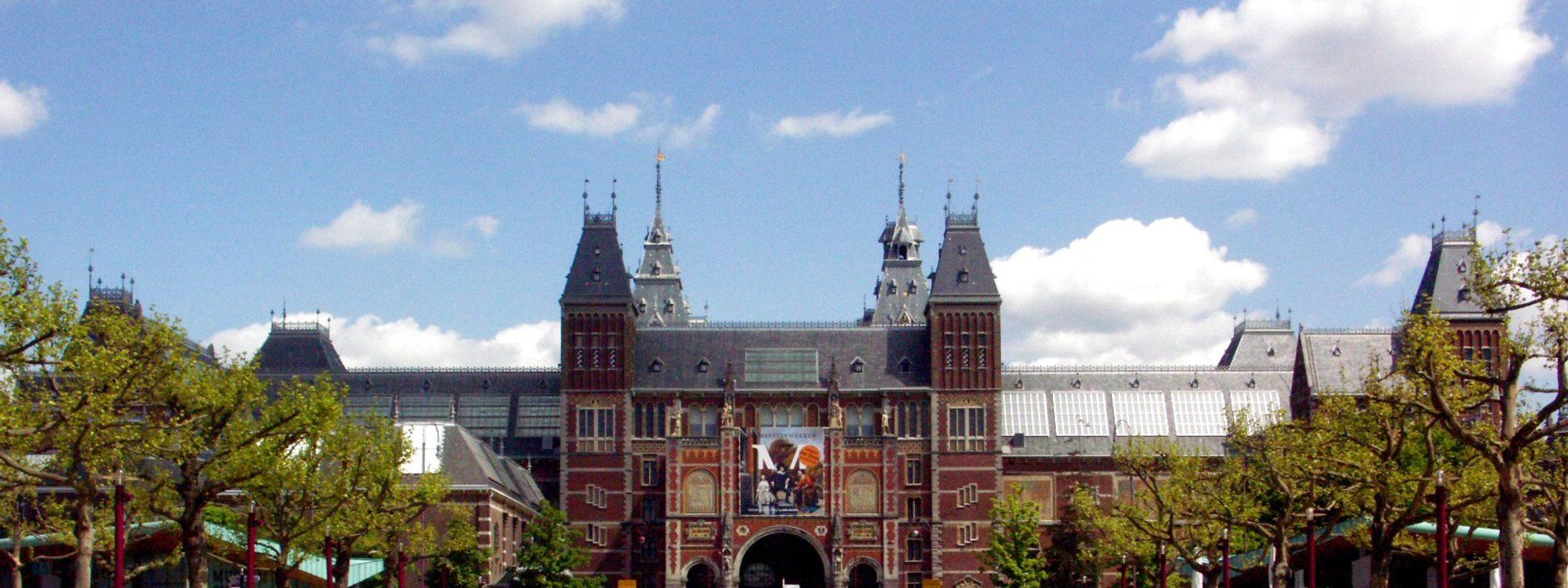 The Rijksmuseum in Amsterdam seen across its garden square on a clear day