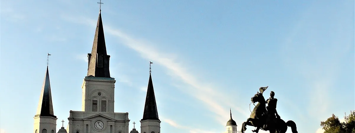 The white spires of St. Louis Cathedral and the Andrew Jackson equestrian statue in Jackson Square, French Quarter