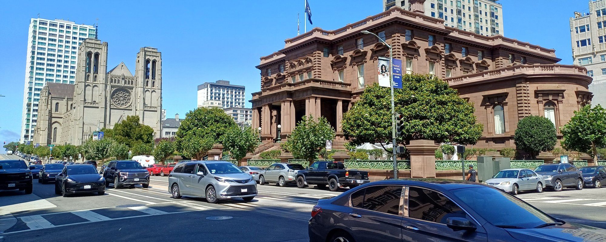 Grace Cathedral's Gothic towers on Nob Hill in San Francisco, seen from California Street next to the historic Flood Mansion