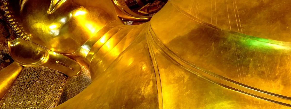 The 46-metre gold-covered Reclining Buddha statue inside Wat Pho temple in Bangkok's Old City