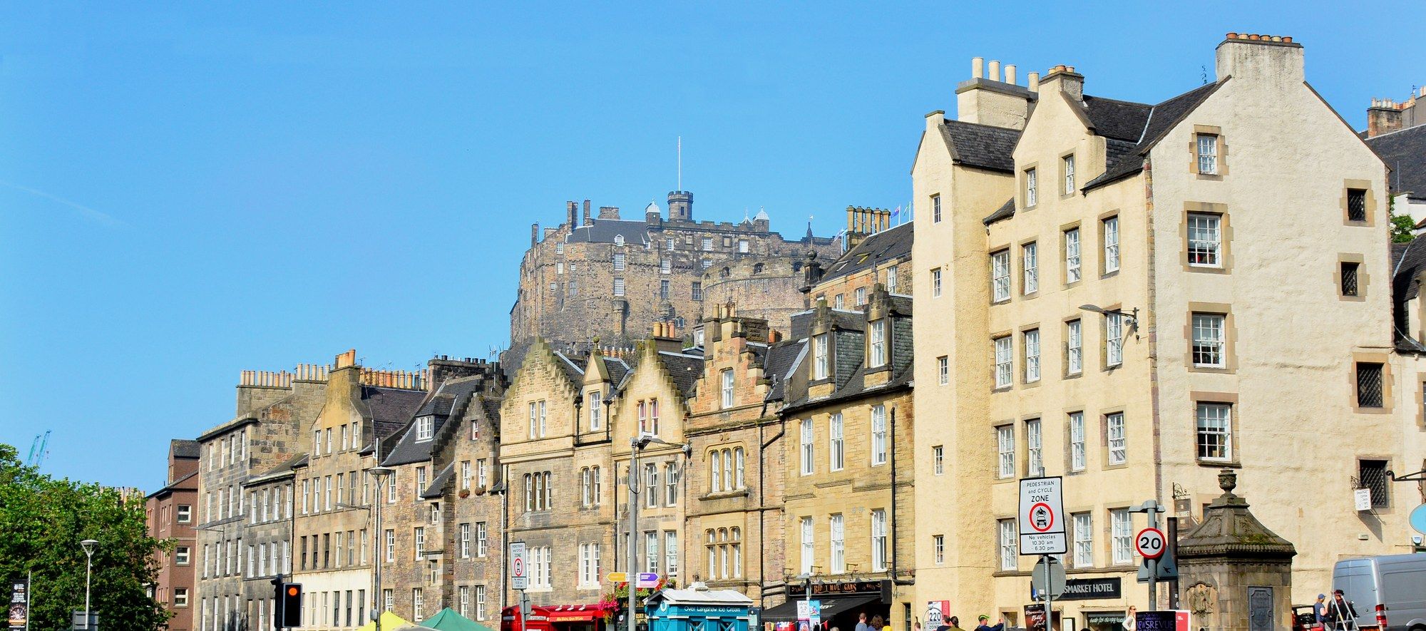 Grassmarket in Edinburgh's Old Town, with historic tenement buildings and Edinburgh Castle rising above them