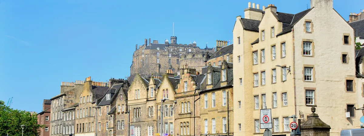 Grassmarket in Edinburgh's Old Town, with historic tenement buildings and Edinburgh Castle rising above them