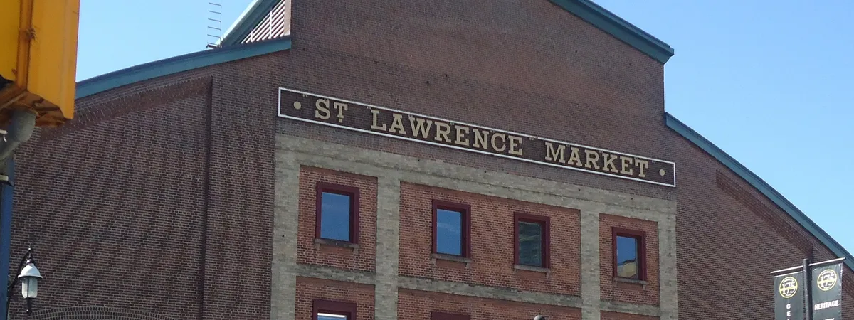 The red-brick facade of St. Lawrence Market in Toronto, with its gold lettered sign above the entrance