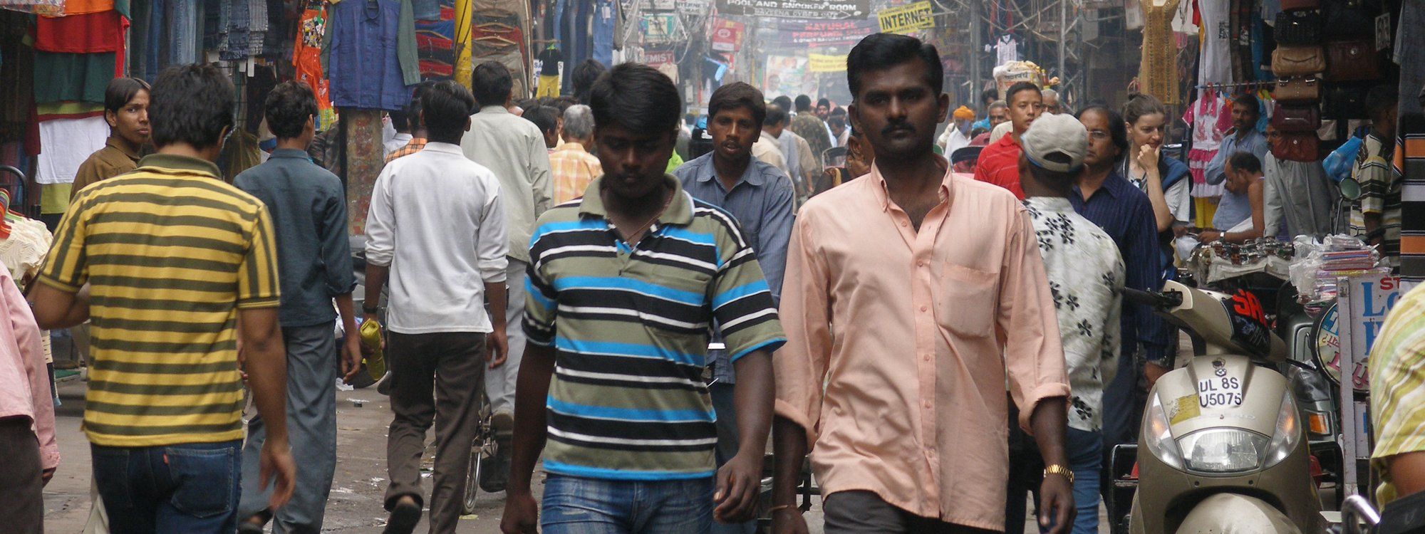 Crowds of shoppers and shopfronts along Main Bazaar, Paharganj's central market street