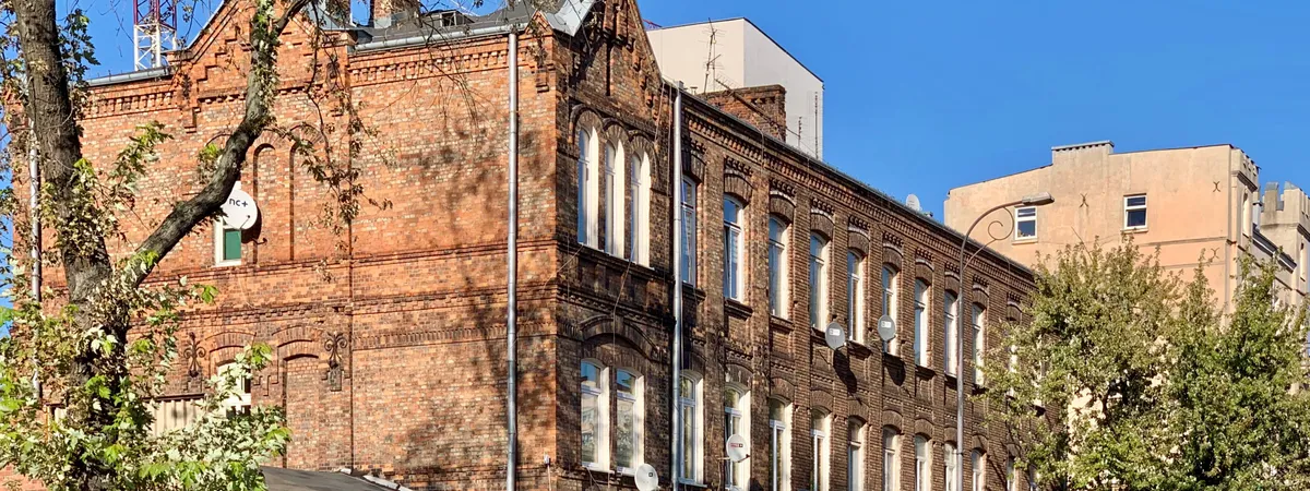 The historic red-brick Koneser vodka factory building on Ząbkowska Street in Warsaw's Praga district