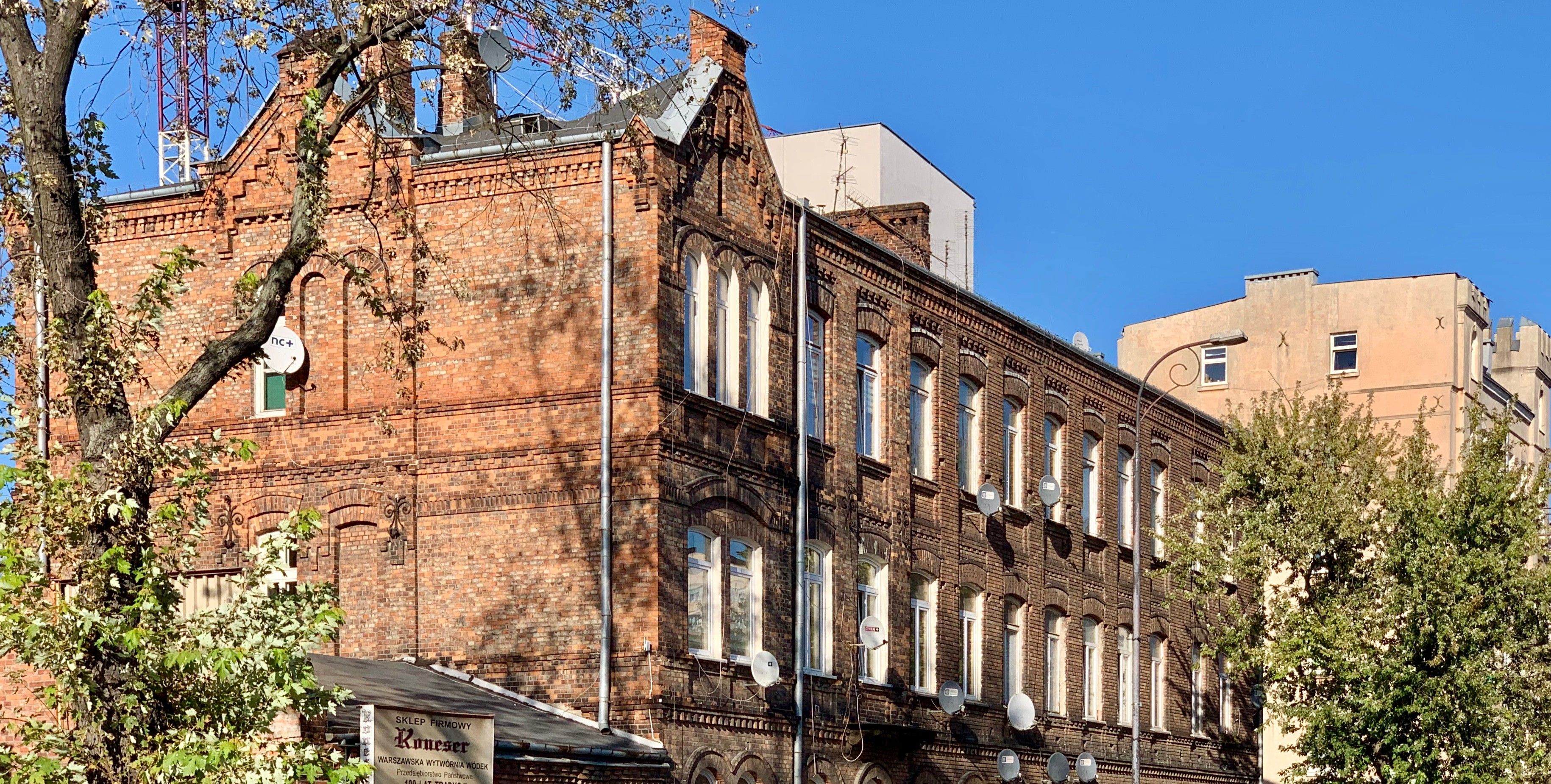The historic red-brick Koneser vodka factory building on Ząbkowska Street in Warsaw's Praga district