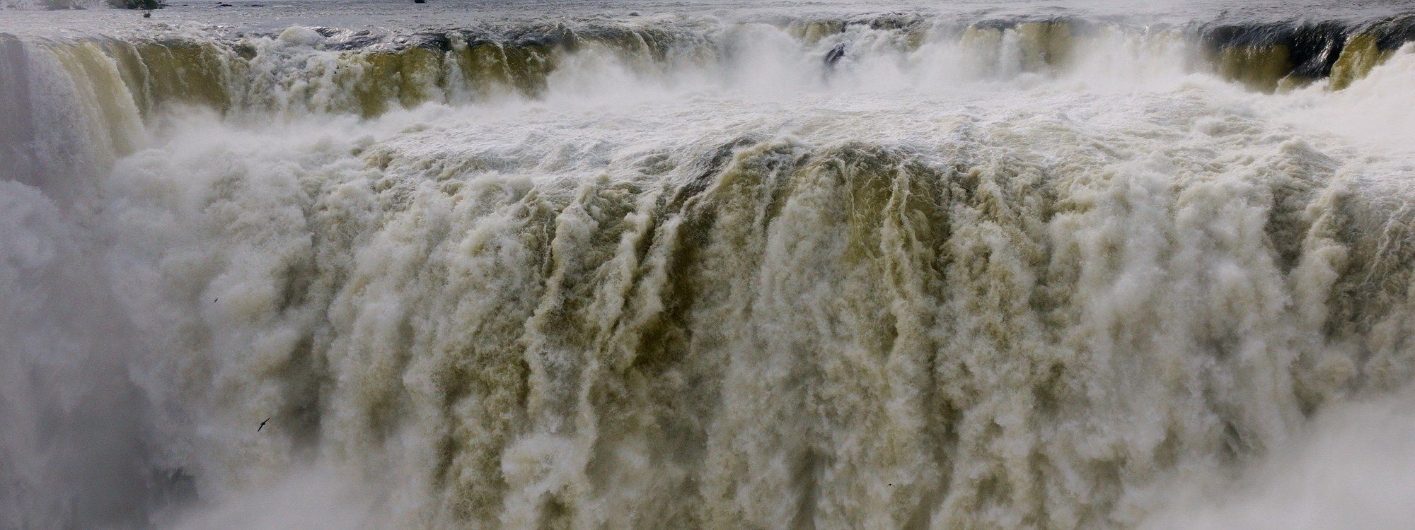 The Devil's Throat (Garganta del Diablo) at Iguazú Falls, seen from the Argentine viewpoint as the Iguazú River plunges over the cliff edge into rising spray