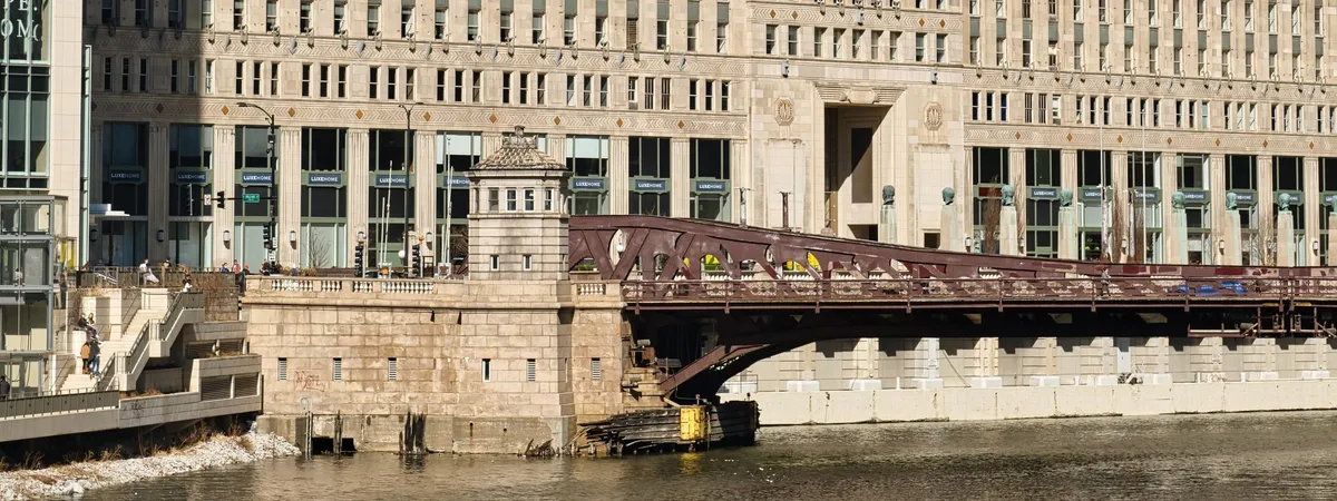 The Merchandise Mart's massive brick facade rising above the Chicago River in River North