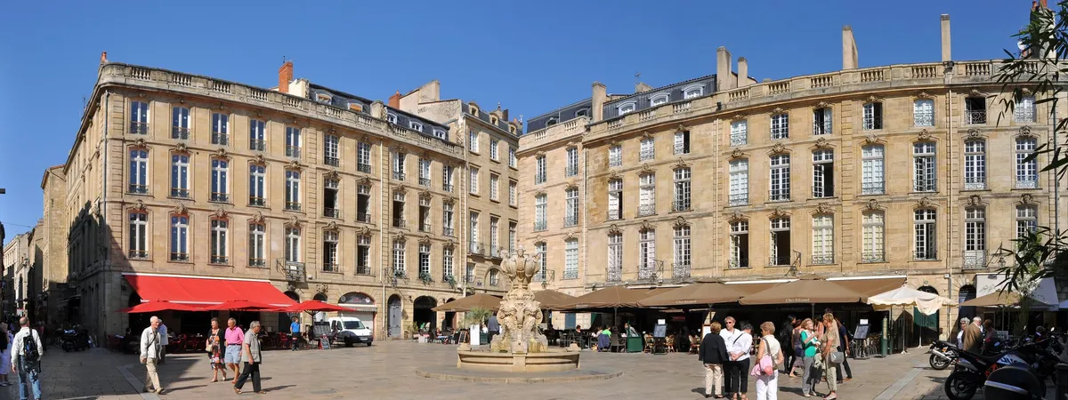 Place du Parlement in Saint-Pierre, Bordeaux, a stone-paved square lined with 18th-century townhouses, café terraces, and a central fountain