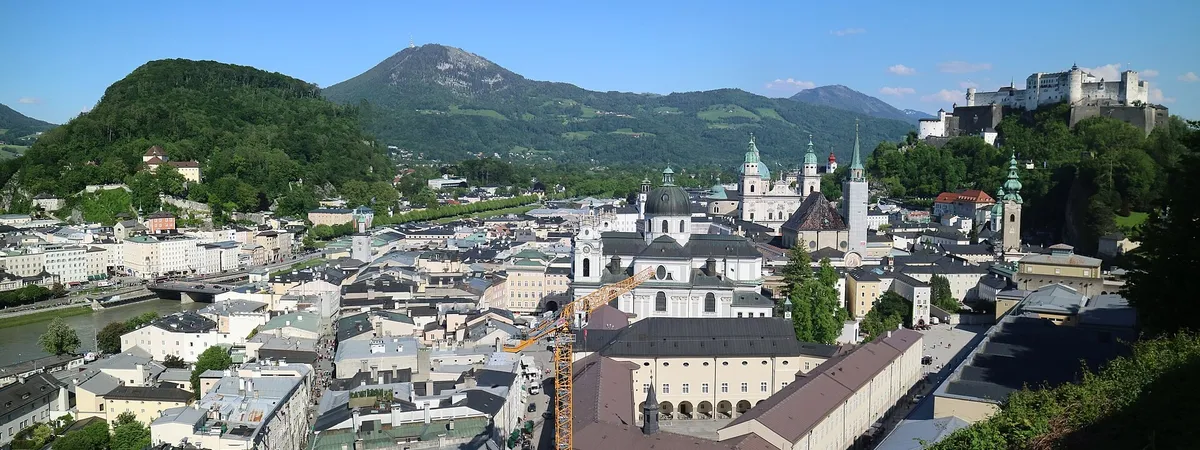 Salzburg's old town skyline of baroque church domes and Hohensalzburg Fortress above the rooftops