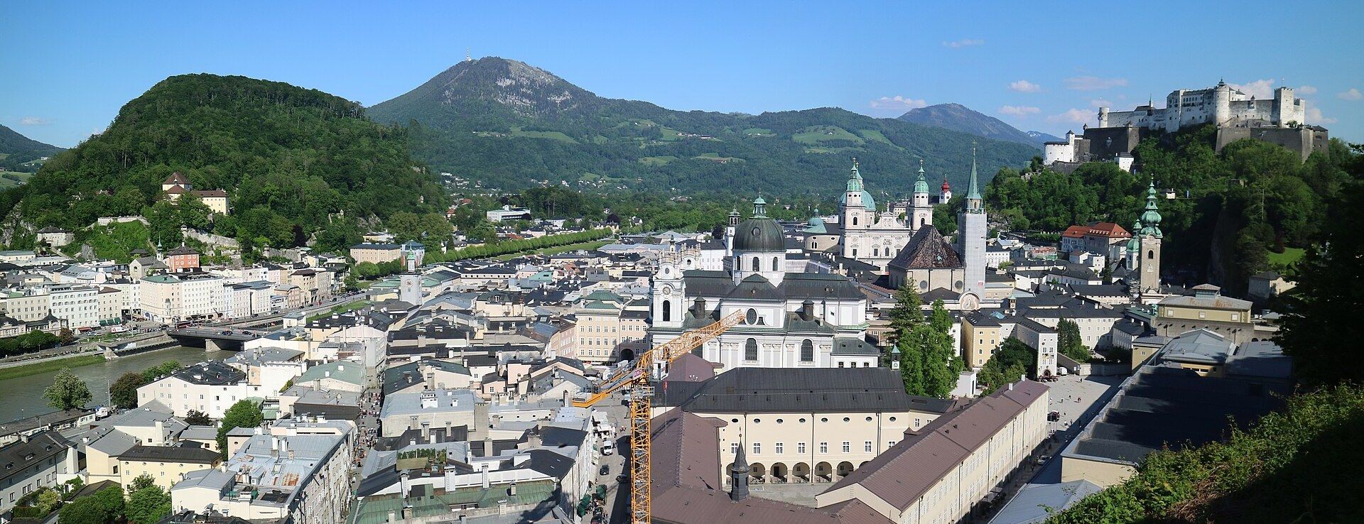 Salzburg's old town skyline of baroque church domes and Hohensalzburg Fortress above the rooftops