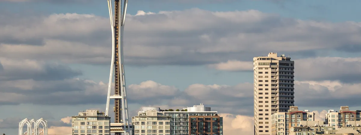 The Space Needle rising above the Seattle skyline and Elliott Bay, seen from across the water near Pier 70