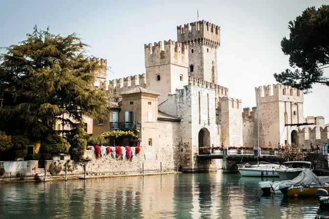 The moated Rocca Scaligera guarding the entrance to Sirmione's old town on Lake Garda