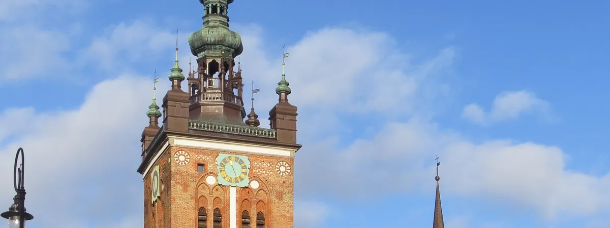 The baroque tower of St. Catherine's Church, Gdańsk's oldest parish church, rising above the Old Town's rooftops