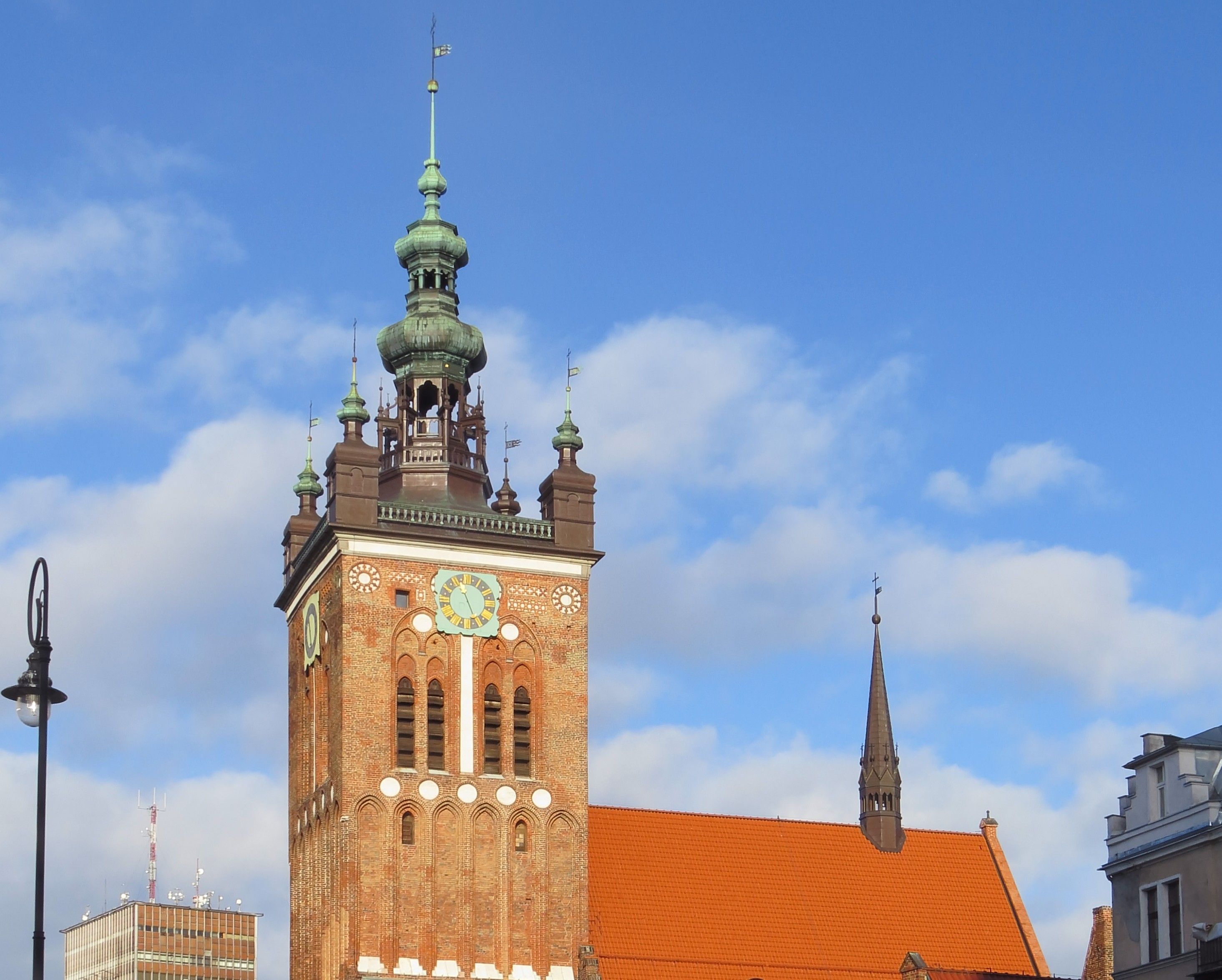 The baroque tower of St. Catherine's Church, Gdańsk's oldest parish church, rising above the Old Town's rooftops