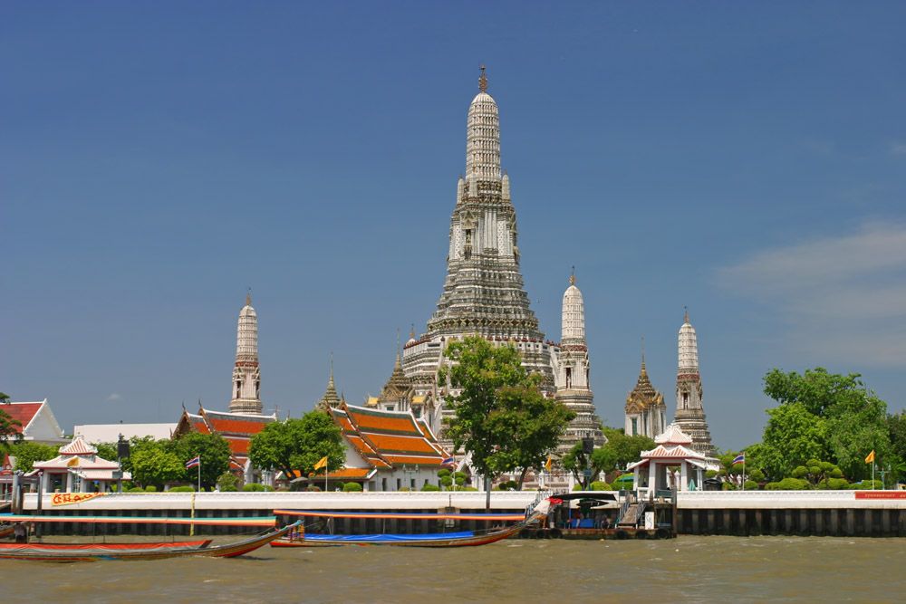 Wat Arun, the Temple of Dawn, rising above the Chao Phraya River in Bangkok