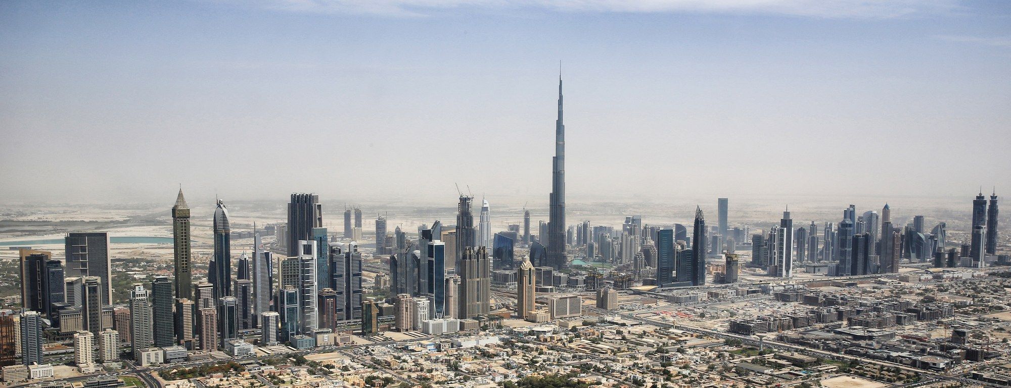 Aerial view of Downtown Dubai's skyline with the Burj Khalifa rising above the surrounding towers