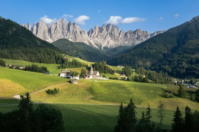 The church of Santa Maddalena on its meadow knoll in Val di Funes, with the jagged Odle ridge rising behind it
