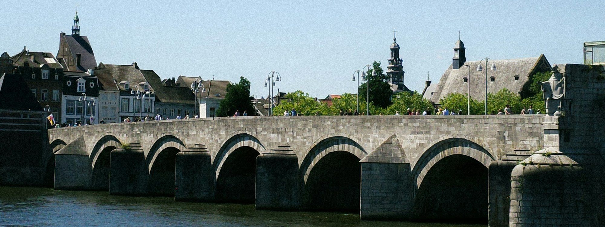The stone arches of the Sint-Servaasbrug over the Maas, the bridge that links Wyck with Maastricht’s old town